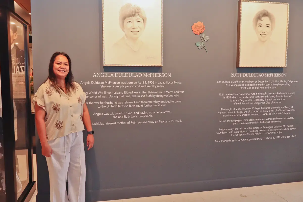 Guest beside the Angela and Ruth Duldulao McPherson memorial wall during a grand-opening celebration at the Philippine Cultural Arts Center in Port Hueneme CA