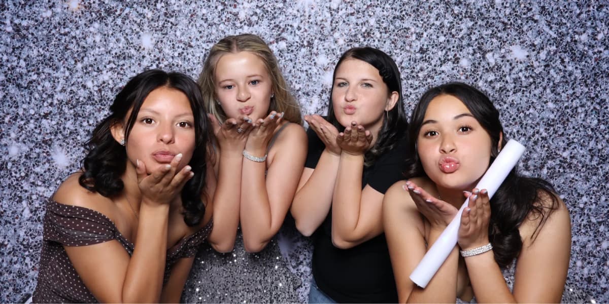 Bilingual photo booth attendant with guests at a Los Angeles quinceañera — Captured Celebrations