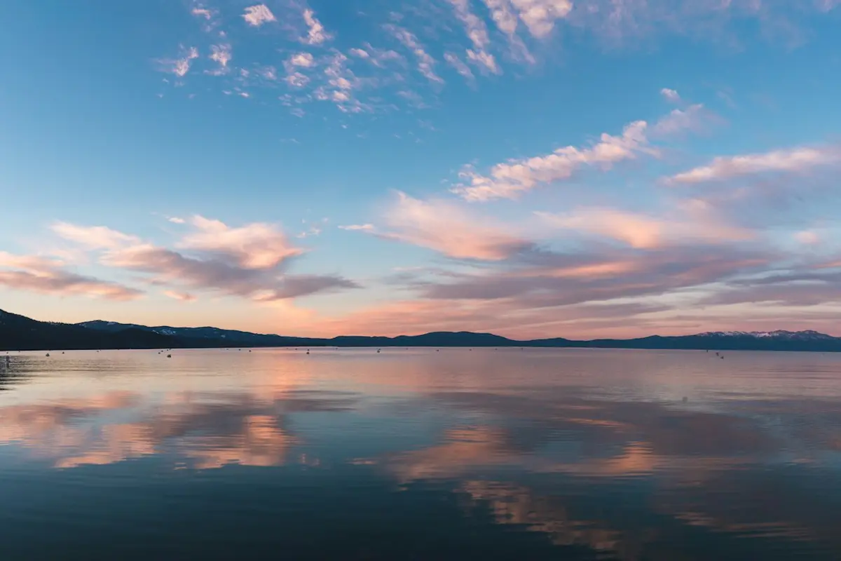 Lake Tahoe at sunset with snow-capped mountains