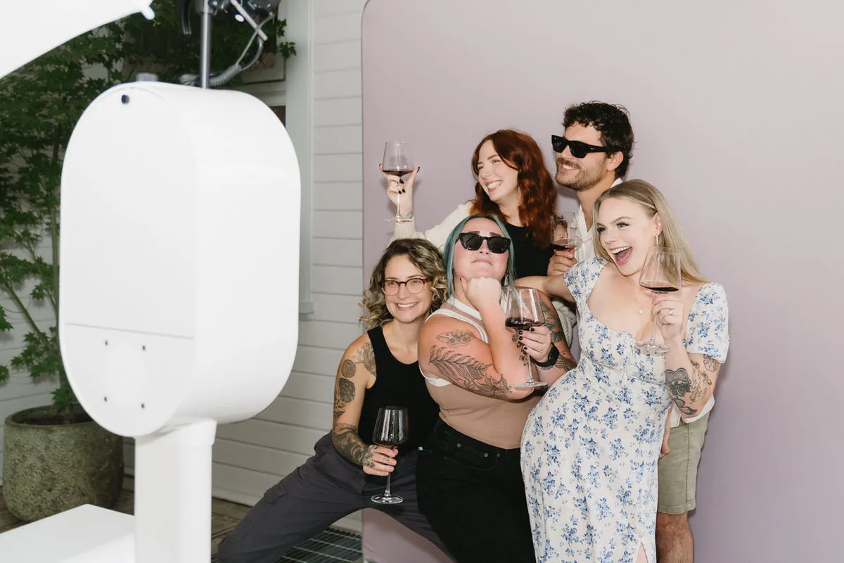 Retro mirror photo booth group shot at corporate event in Los Angeles — premium magic mirror rental, Captured Celebrations