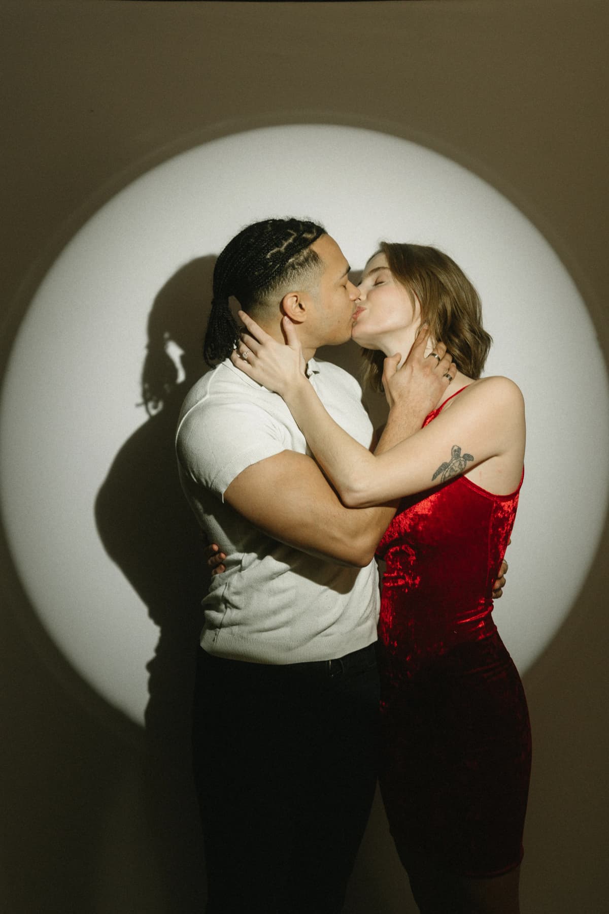 Spotlight photo booth with dramatic editorial lighting capturing a couple at a San Fernando Valley event