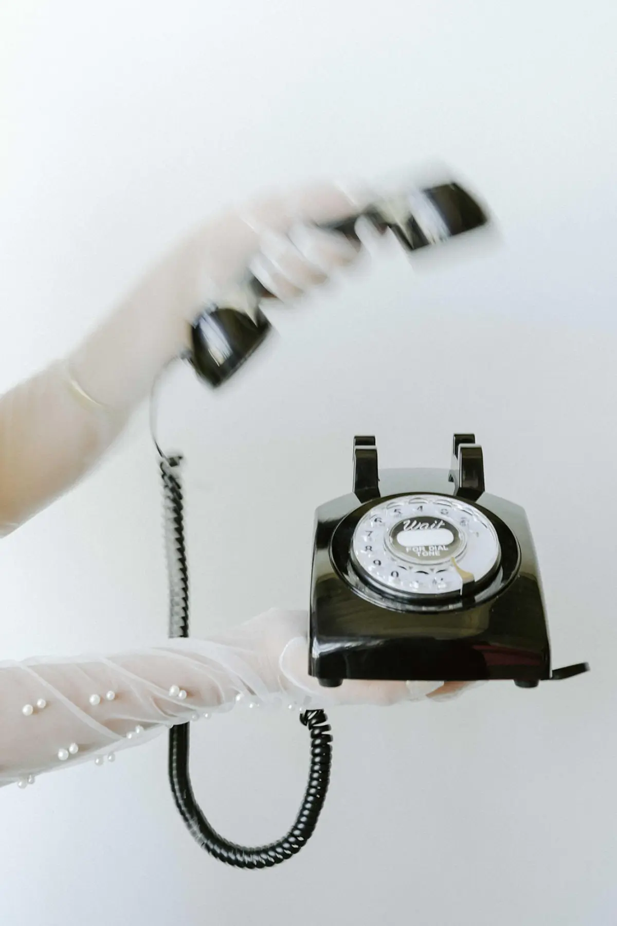 Guest leaving a message on a black audio guestbook phone