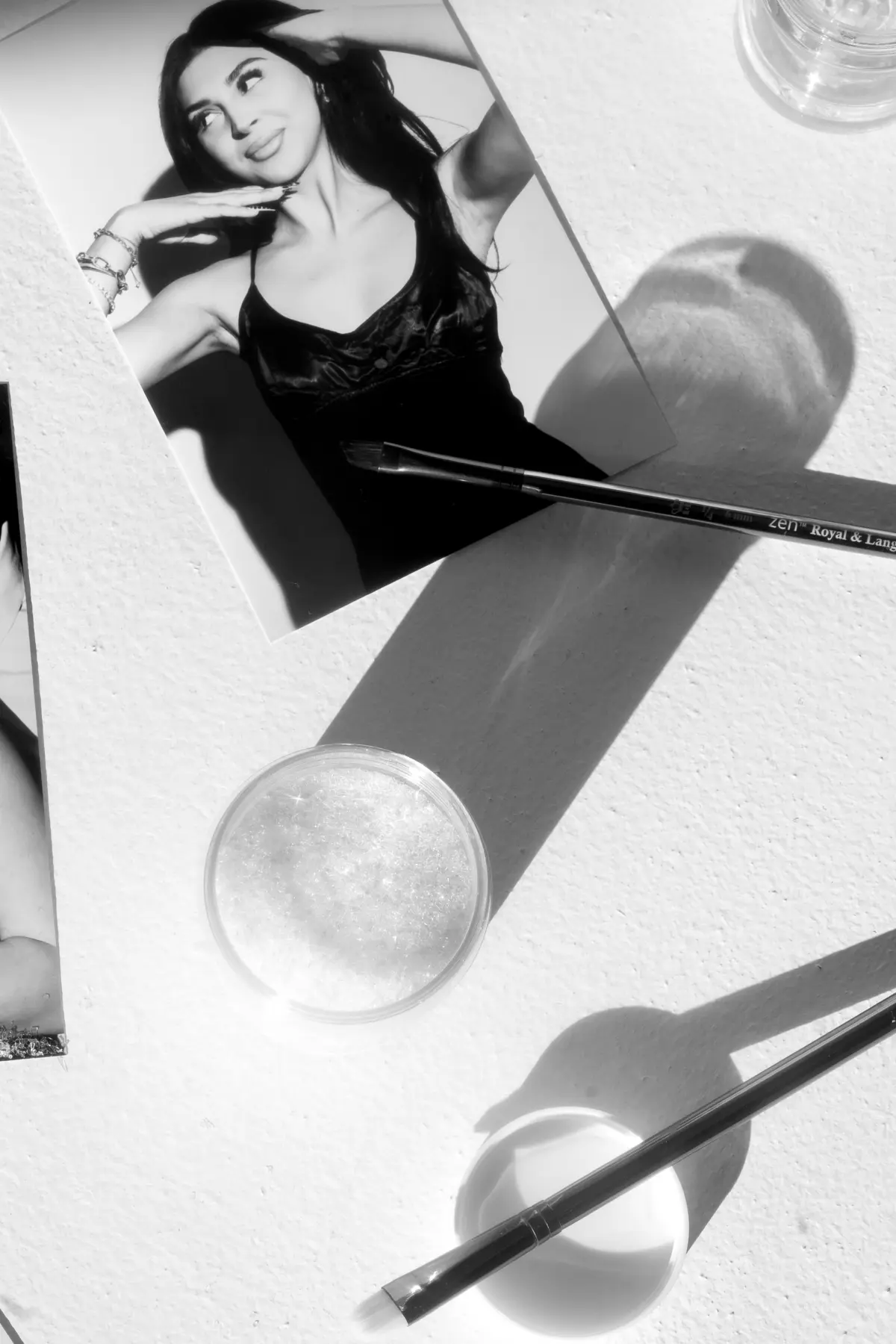 Glitter being brushed onto a photo booth print in Los Angeles