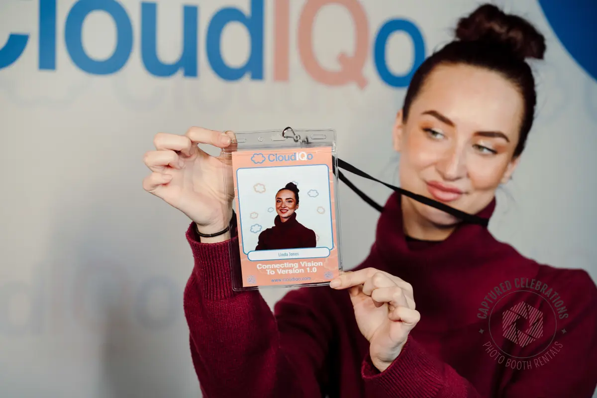 Guest holding a personalised badge lanyard at a trade show