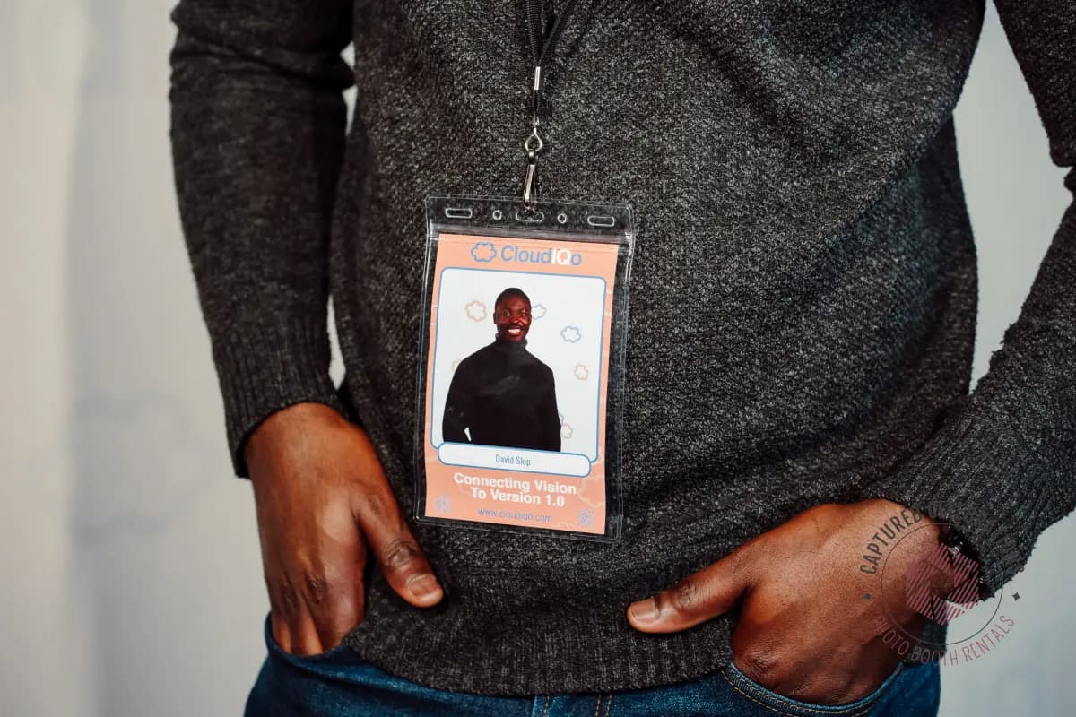 Attendee wearing a branded photo badge lanyard at a conference