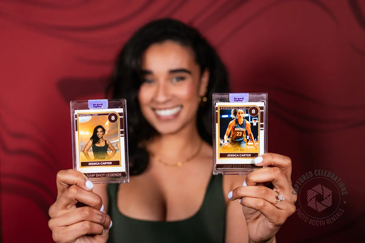 Encased photo booth trading cards held by a guest