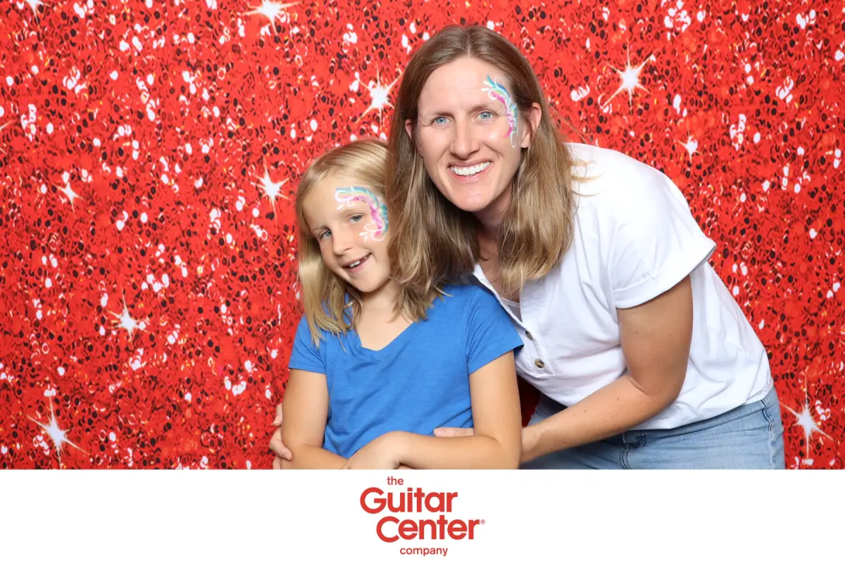 Guests with matching face paint at the Captured Celebrations photo booth during Guitar Center Jam Night in Thousand Oaks, Ventura County CA
