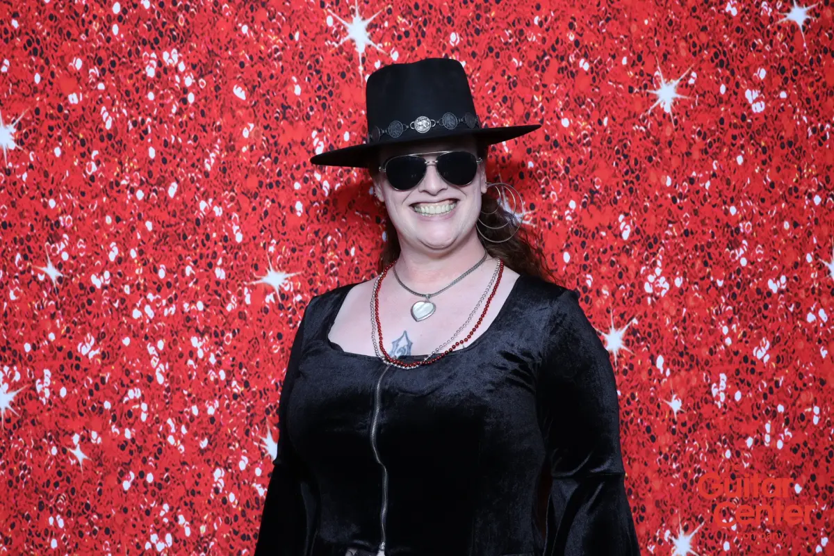Guest in a black hat at the Captured Celebrations AI Print Booth during Guitar Center Service Awards Jam Night in Ventura County CA