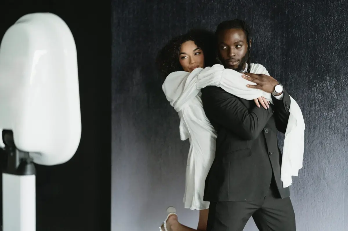 Couple posing at a Captured Celebrations photo booth in Los Angeles