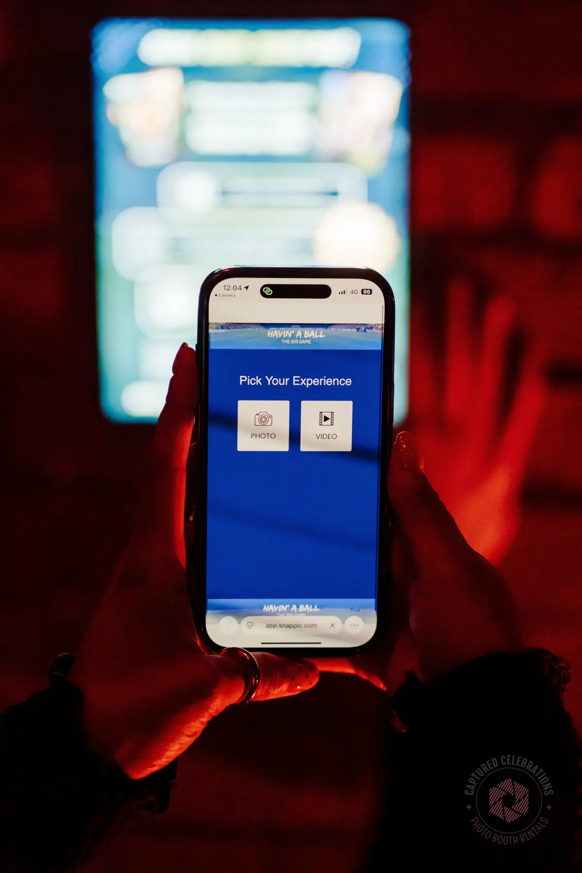 Guest choosing photo or video on their own phone at a virtual booth