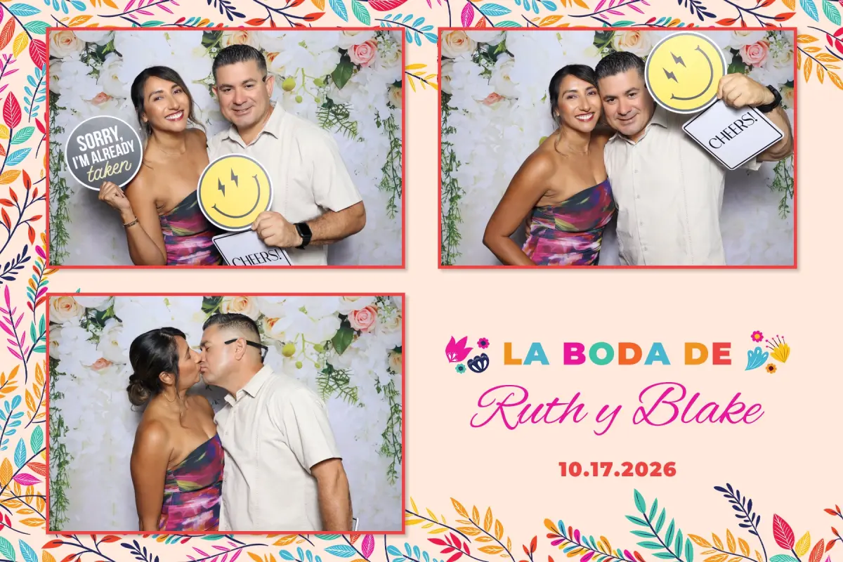Couple posing with Cheers and smiley props in the open air photo booth at a Chloe's at Golden Road Brewing wedding