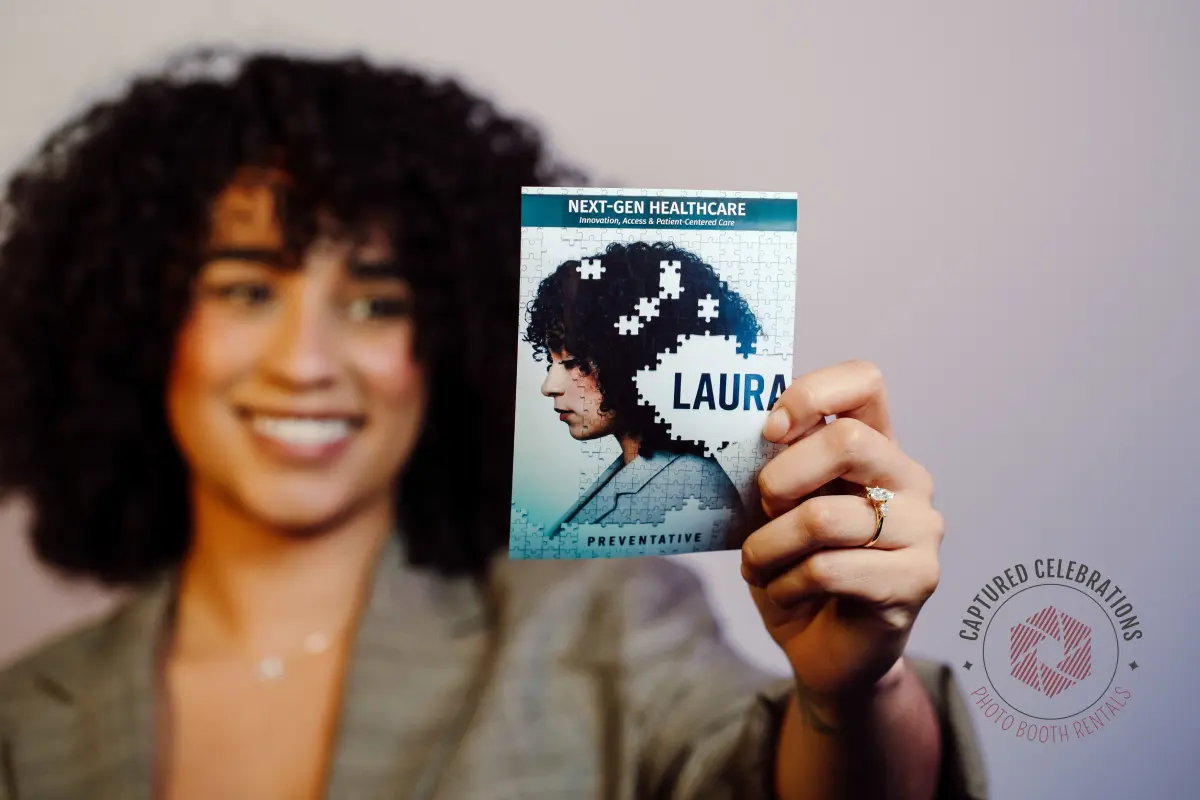 Guest holding AI-generated Next-Gen Healthcare branded photo card from Los Angeles brand activation