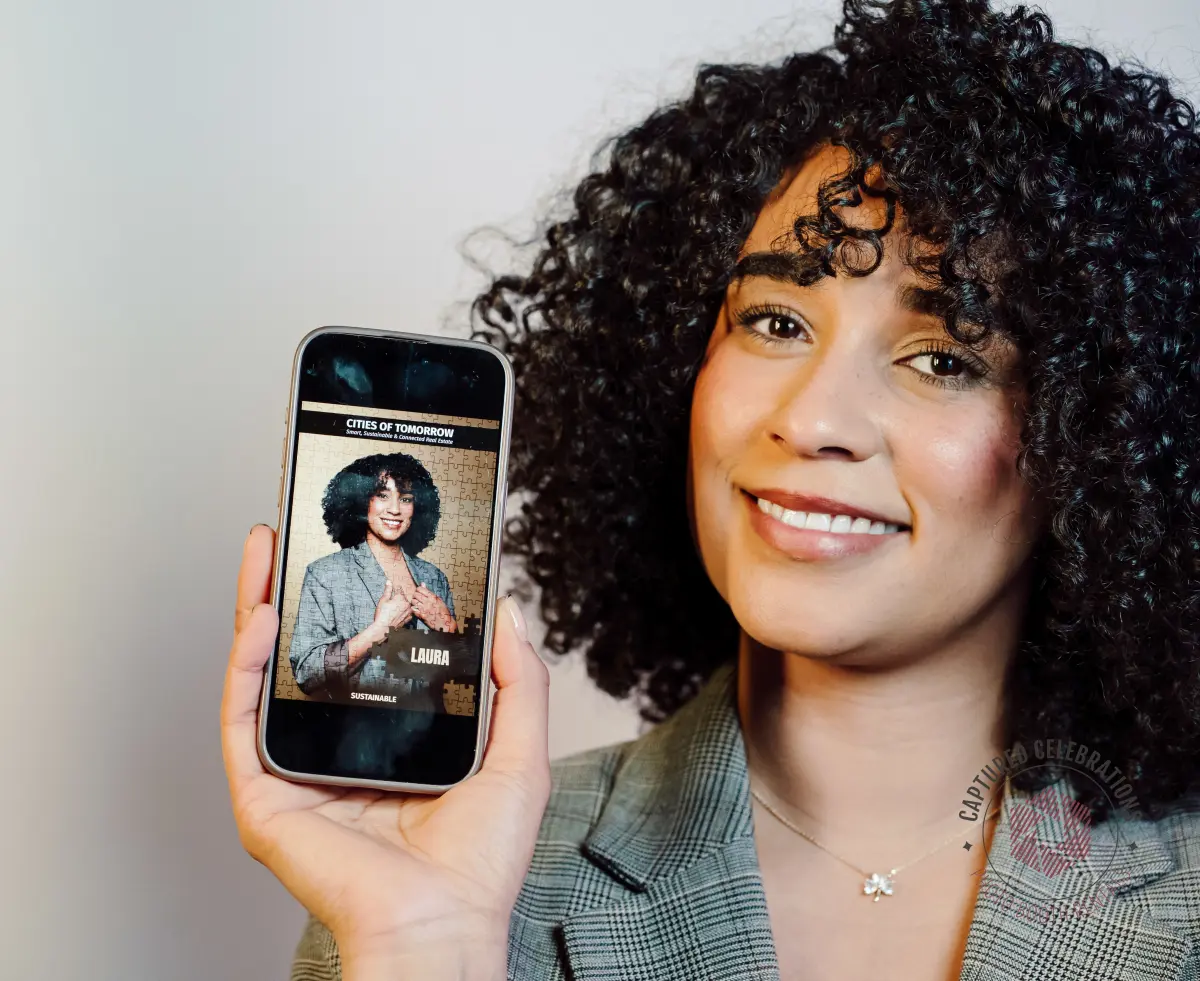 Guest holding phone showing her personalized AI-generated brand activation photo at a Los Angeles event