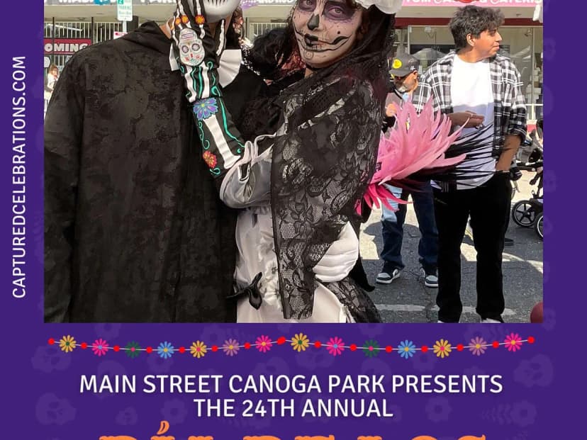 Families in calavera costumes at Dia de los Muertos photo booth in Los Angeles