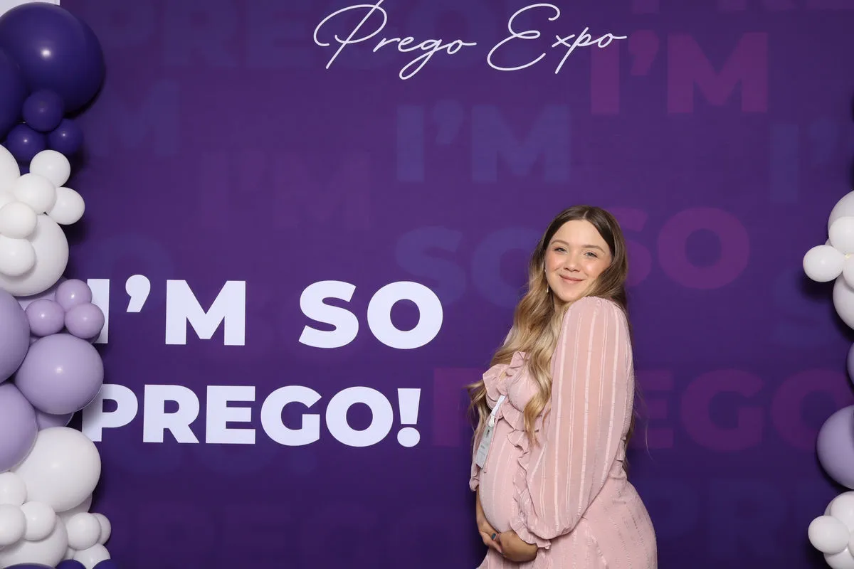 Guests posing at the Captured Celebrations branded photo booth at Prego Expo Los Angeles 2025