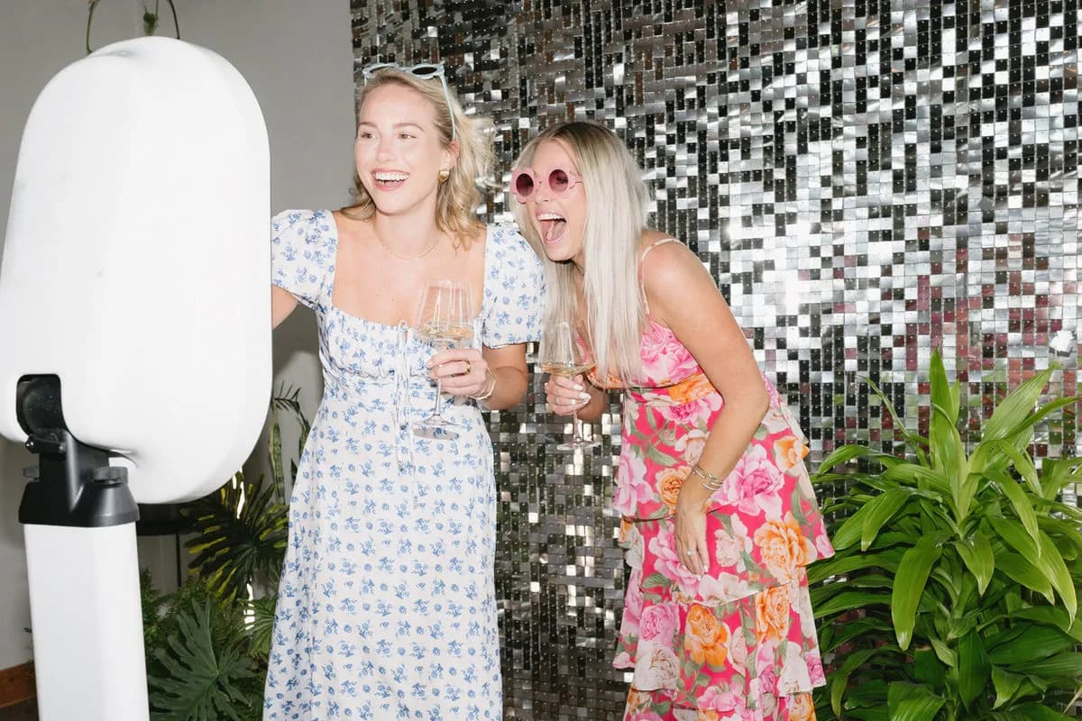 Two women posing at a studio quality photo booth experience in Los Angeles