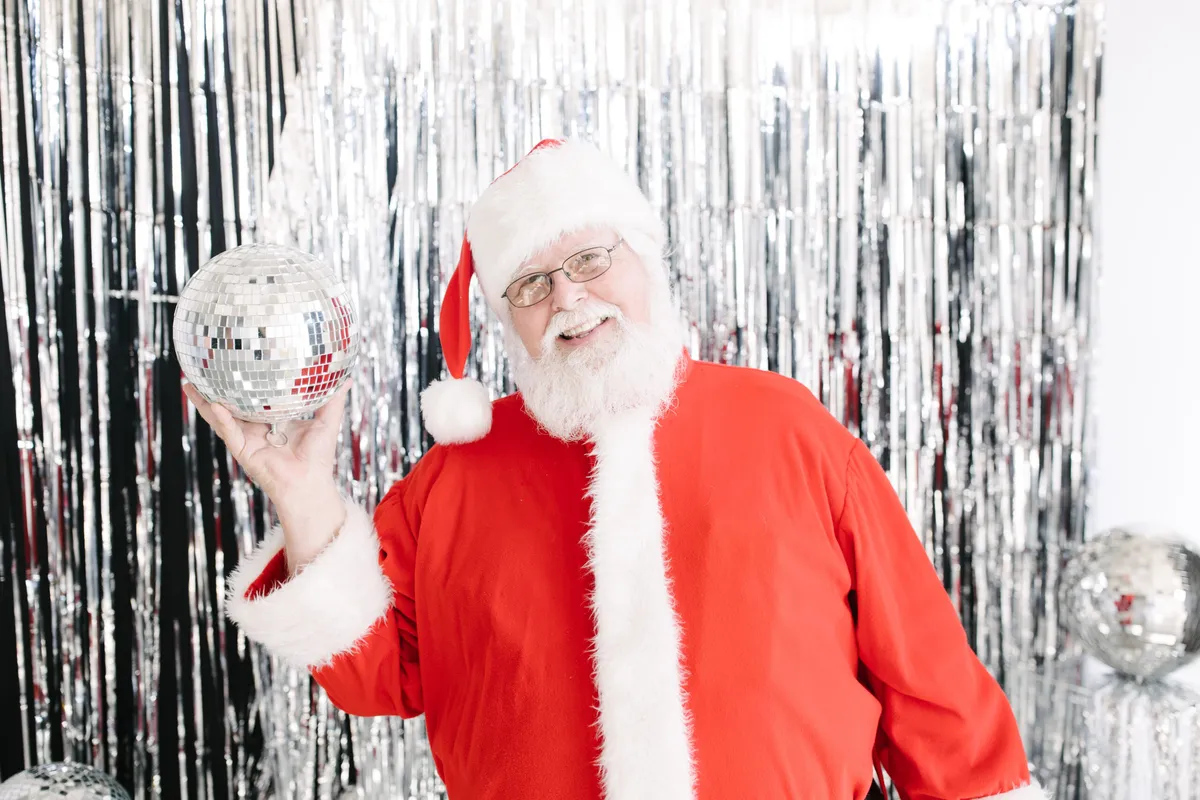Santa taking a photo in the photobooth