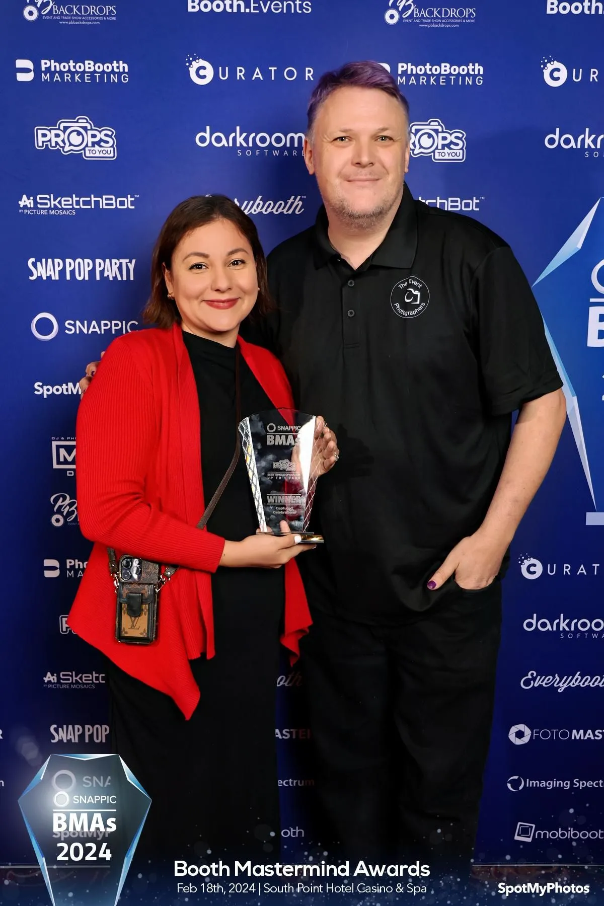 Liz and the owner of Props to you taking a picture with the winning award