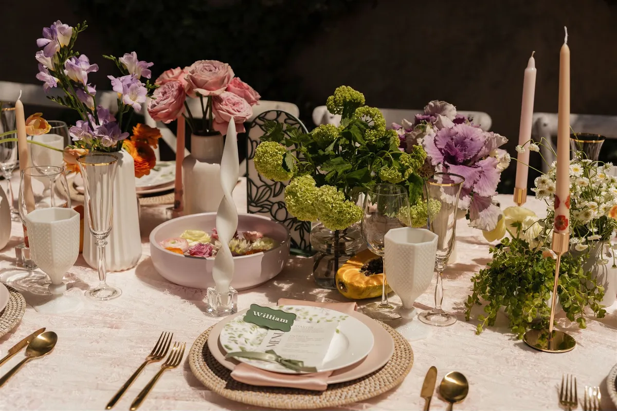Elegant wedding table setting with floral arrangements and place cards