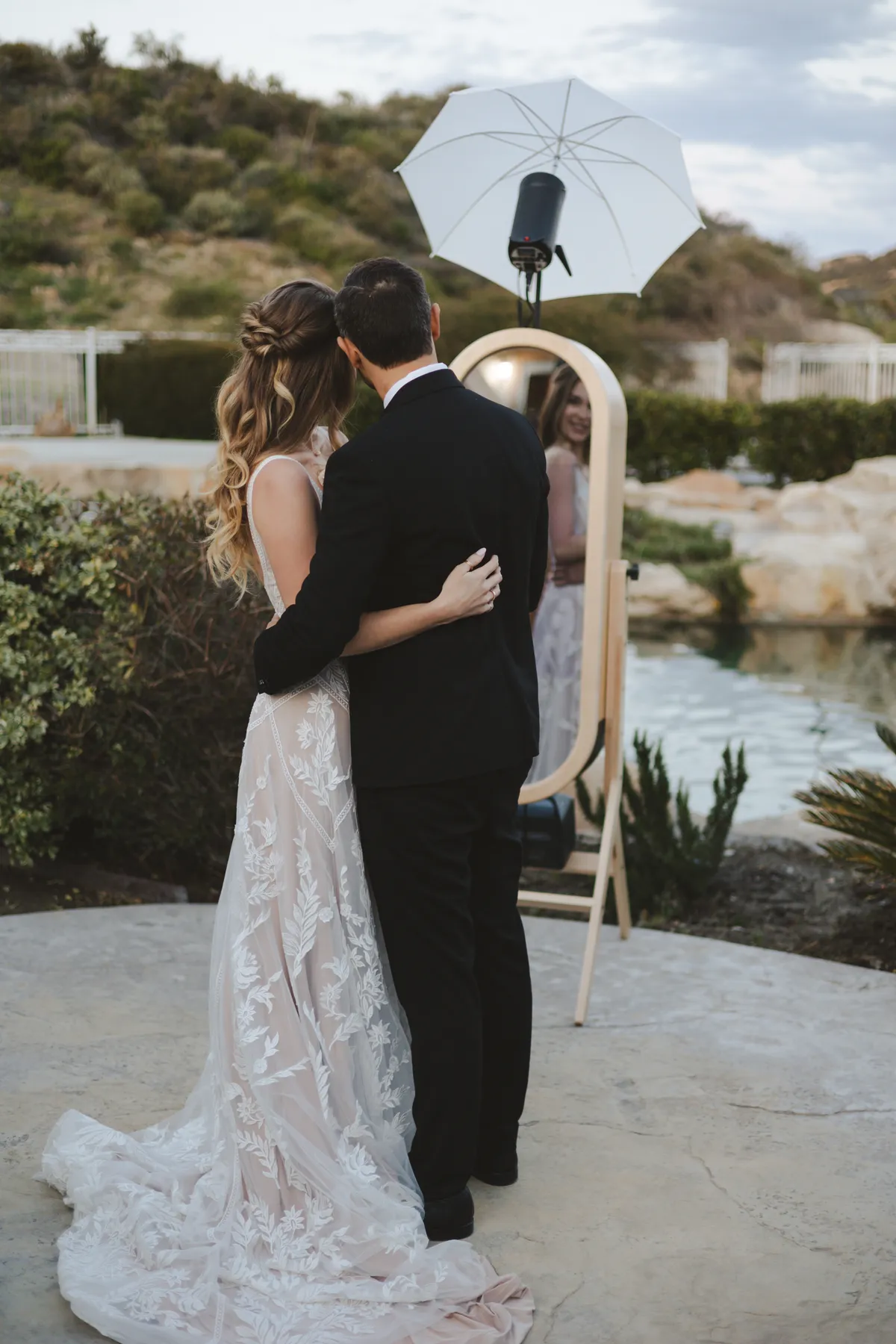 bride and groom in front of the vintage photo booth 