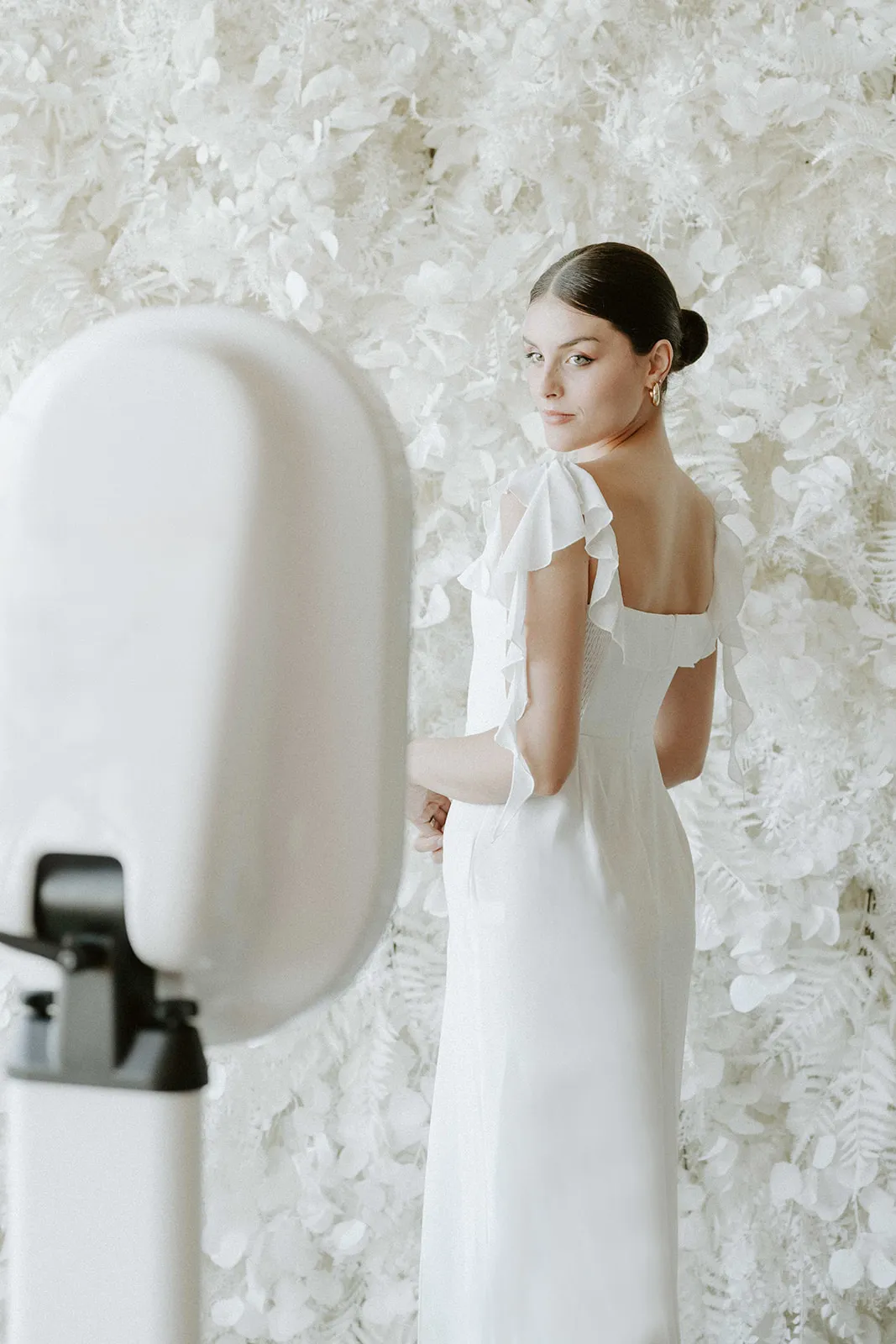 Open air photo booth being used by a bride