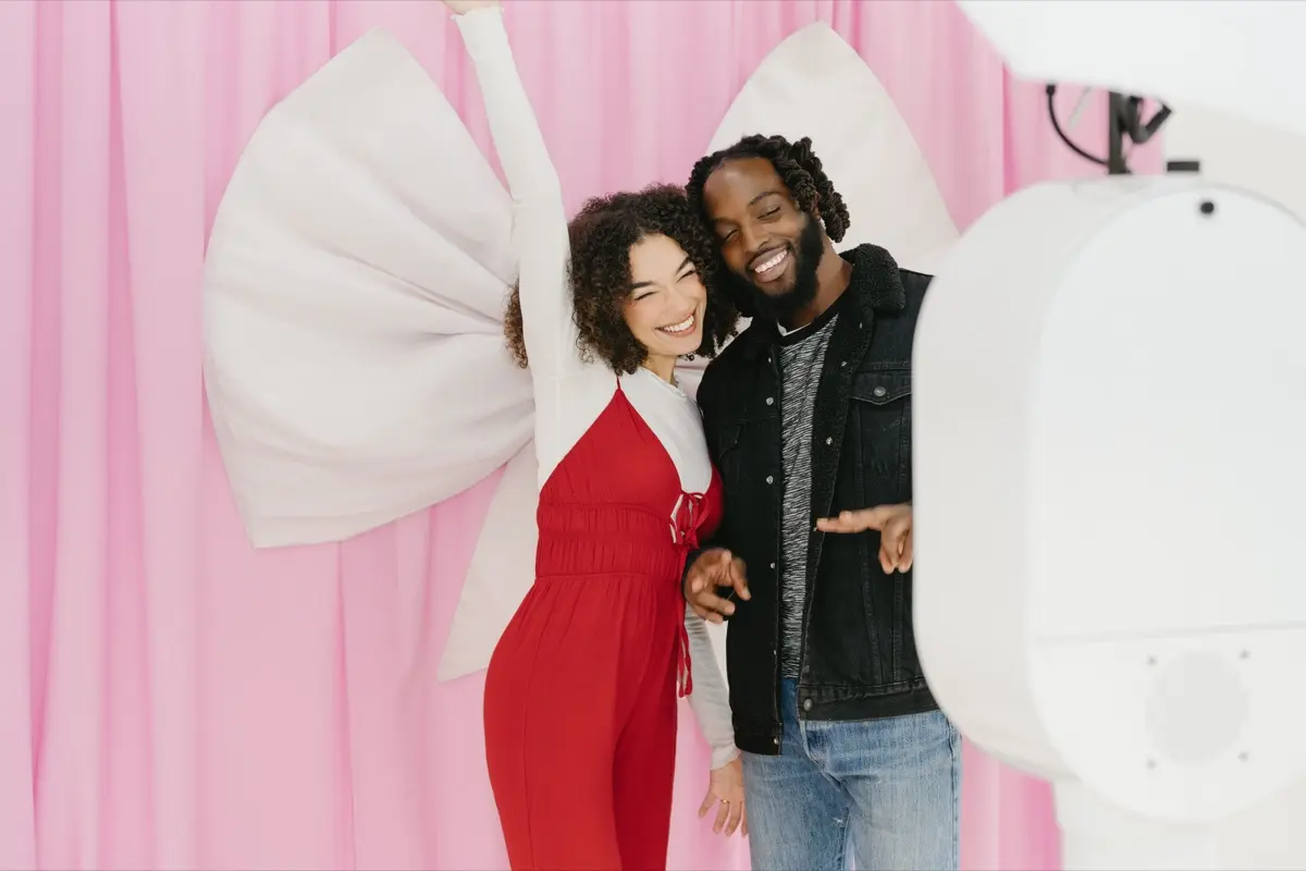 Bridal photo booth with pink bow backdrop at a Los Angeles celebration