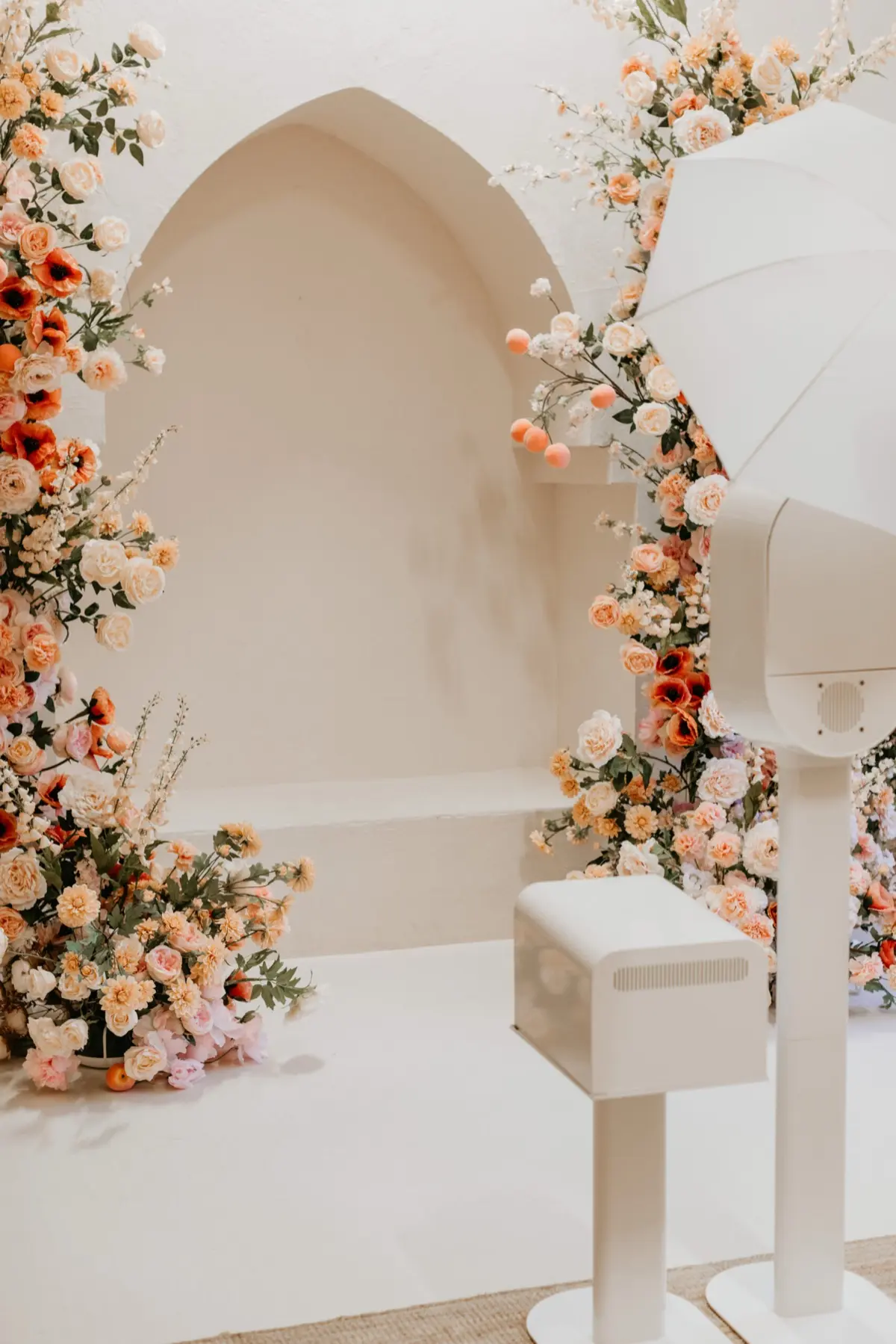 Peachy themed photo booth with elegant styling at a corporate activation