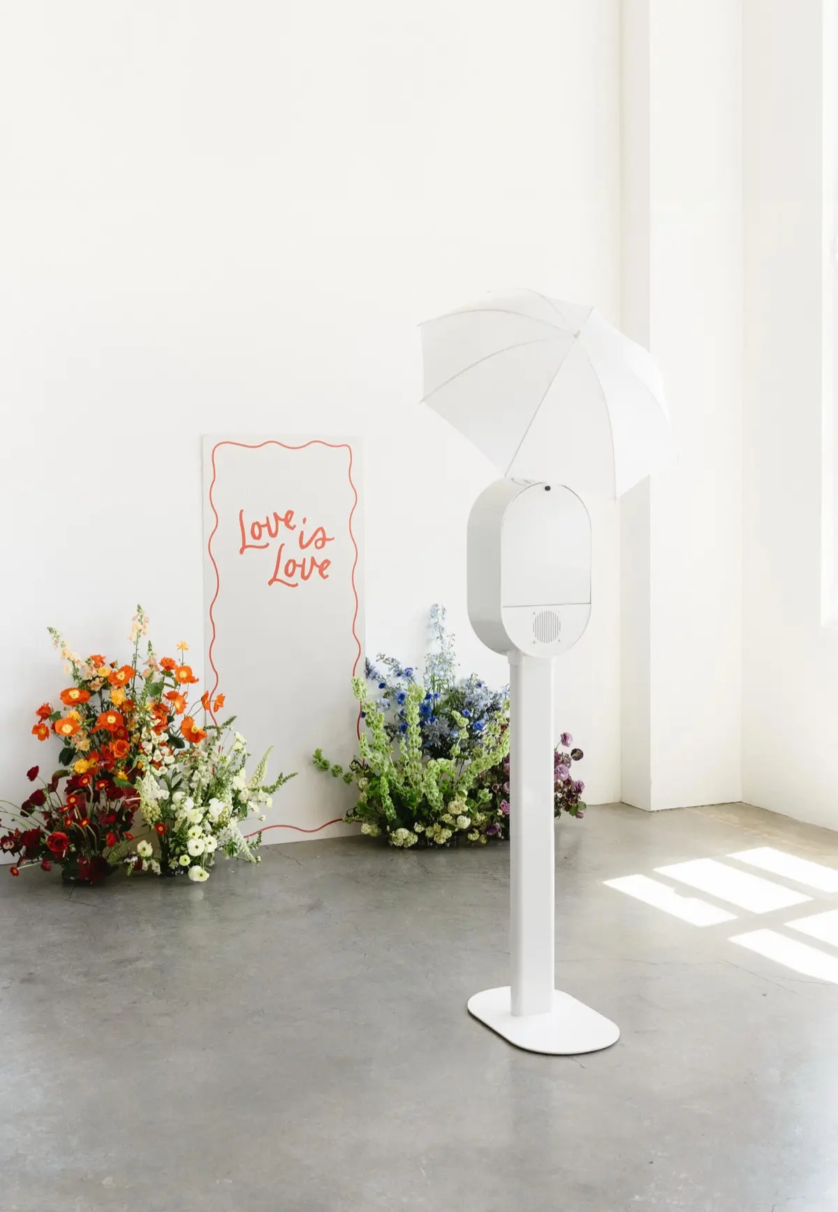 Pride rainbow themed photo booth representing community resilience and celebration