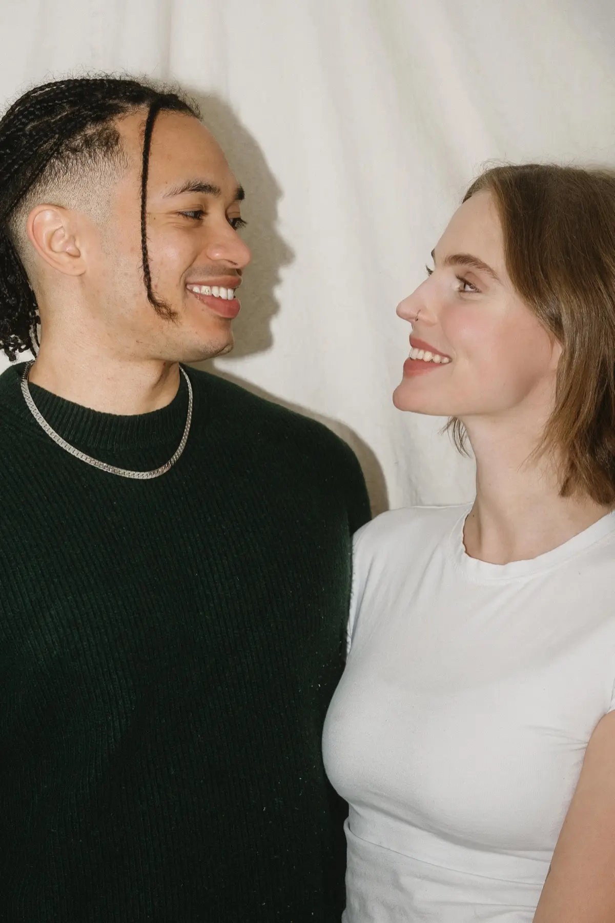 Couples celebrating love at a Valentine's photo booth in Los Angeles