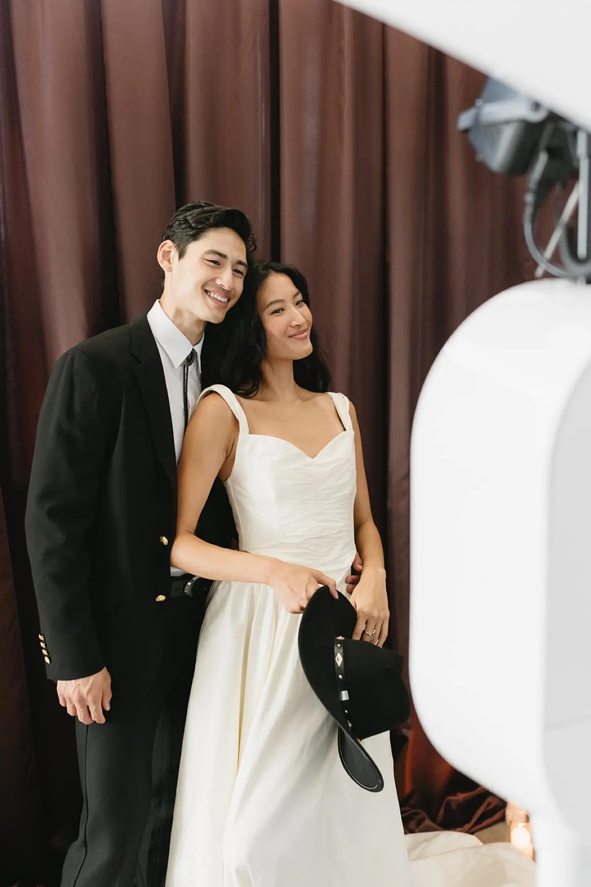 Western-themed vintage photo booth with brown curtain in Los Angeles